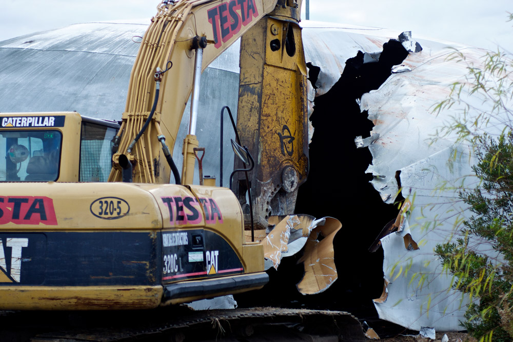 chewing the metal water tower demolition - Freeland Construction