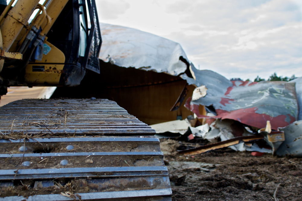 chewing the metal water tower demolition - Freeland Construction