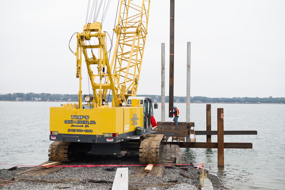 Crane doing pile driving