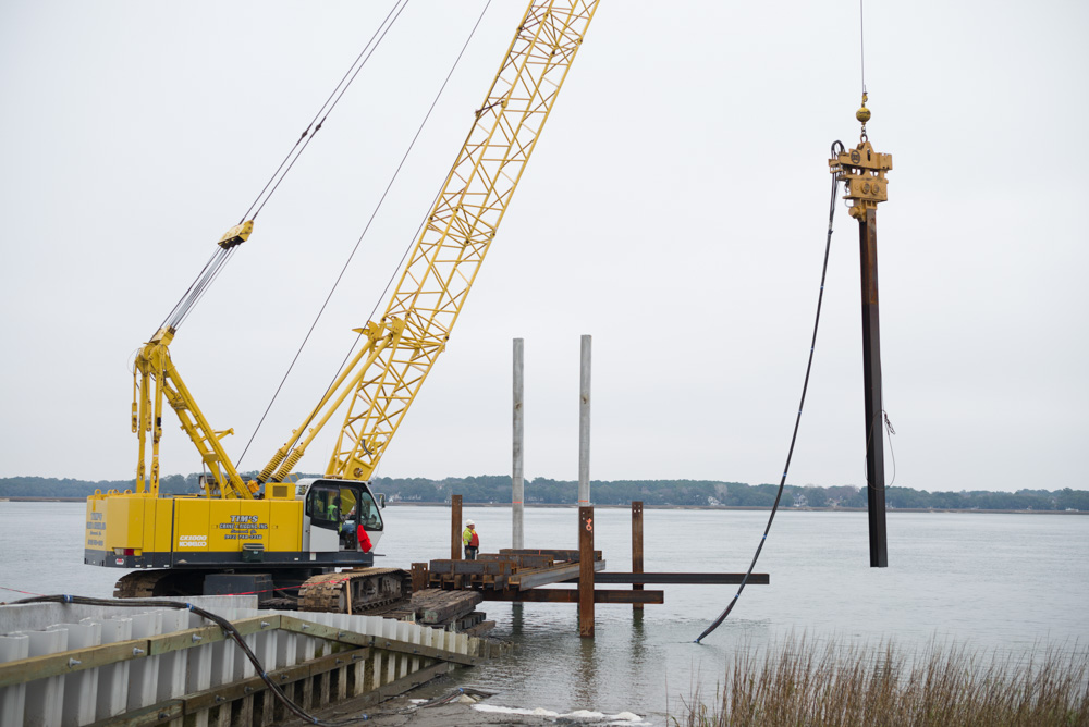 Crane doing pile driving