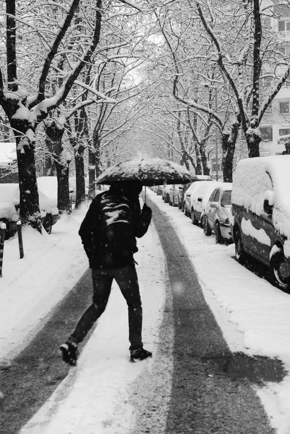 High contrast man with umbrella